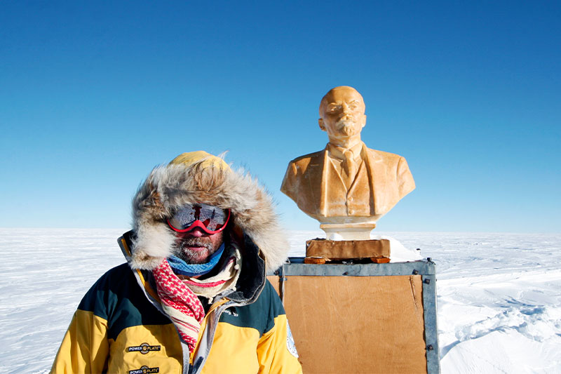 Polar Explorer Henry Cookson next to the Statue of Lenin at the Southern POI
