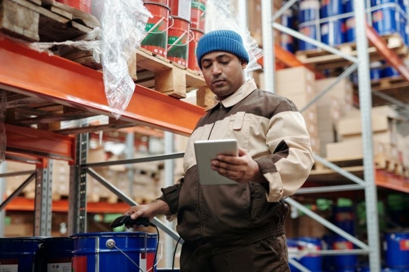 Warehouse worker scanning product Obstacles to the Transportation and Logistics industry