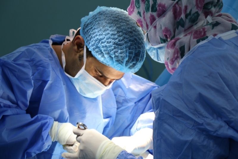 A surgeon doing surgery