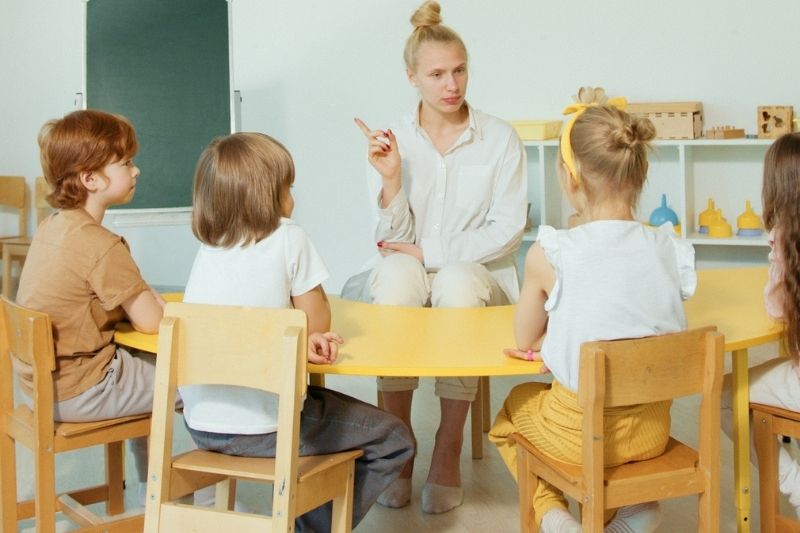 A teacher teaching kids