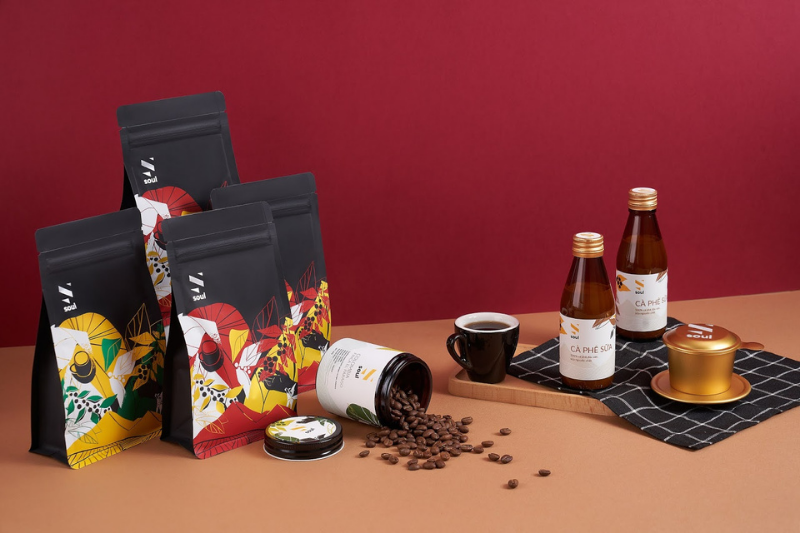 bags of coffee beans and cold brew laid out on a table