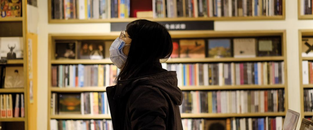 white wabbit records taipei woman standing in front of shelves of vinyl records